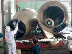 Double-cone dryer coated with PFA to protect against corrosion and prevent sticking