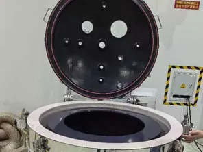 Top discharge centrifuge coated with high-purity PFA for contamination control