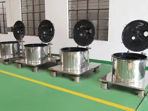 Top discharge centrifuge coated with Halar for anti-static performance