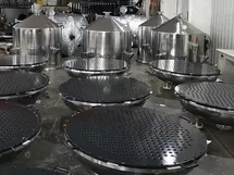 Perforated filter plates coated with PFA to improve chemical resistance and minimize material buildup