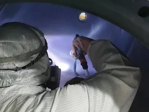 Coating operations in Class 1,000 cleanroom